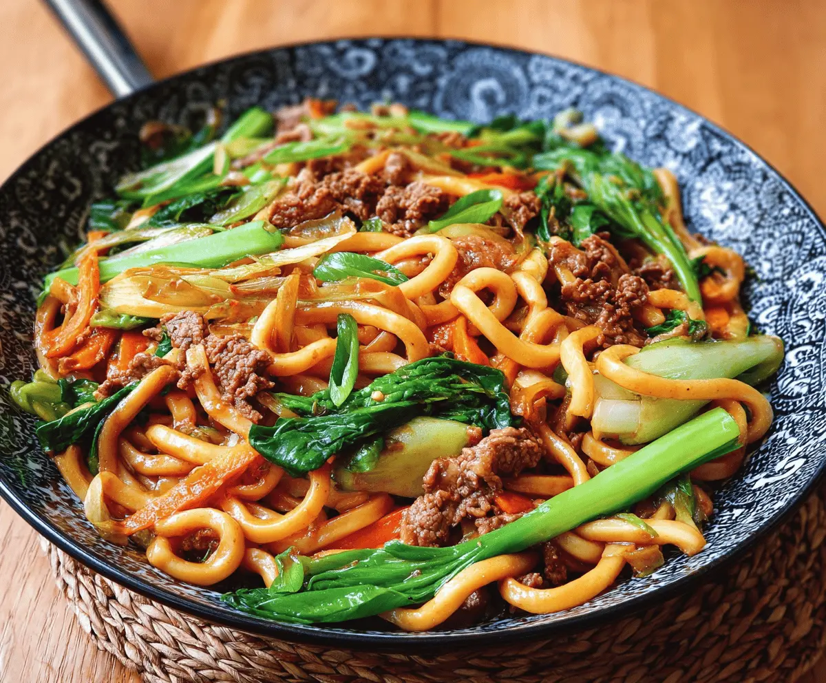 Delicious Yaki Udon noodle stir-fry with vegetables and savory sauce on a plate, perfect for quick Asian-inspired meals