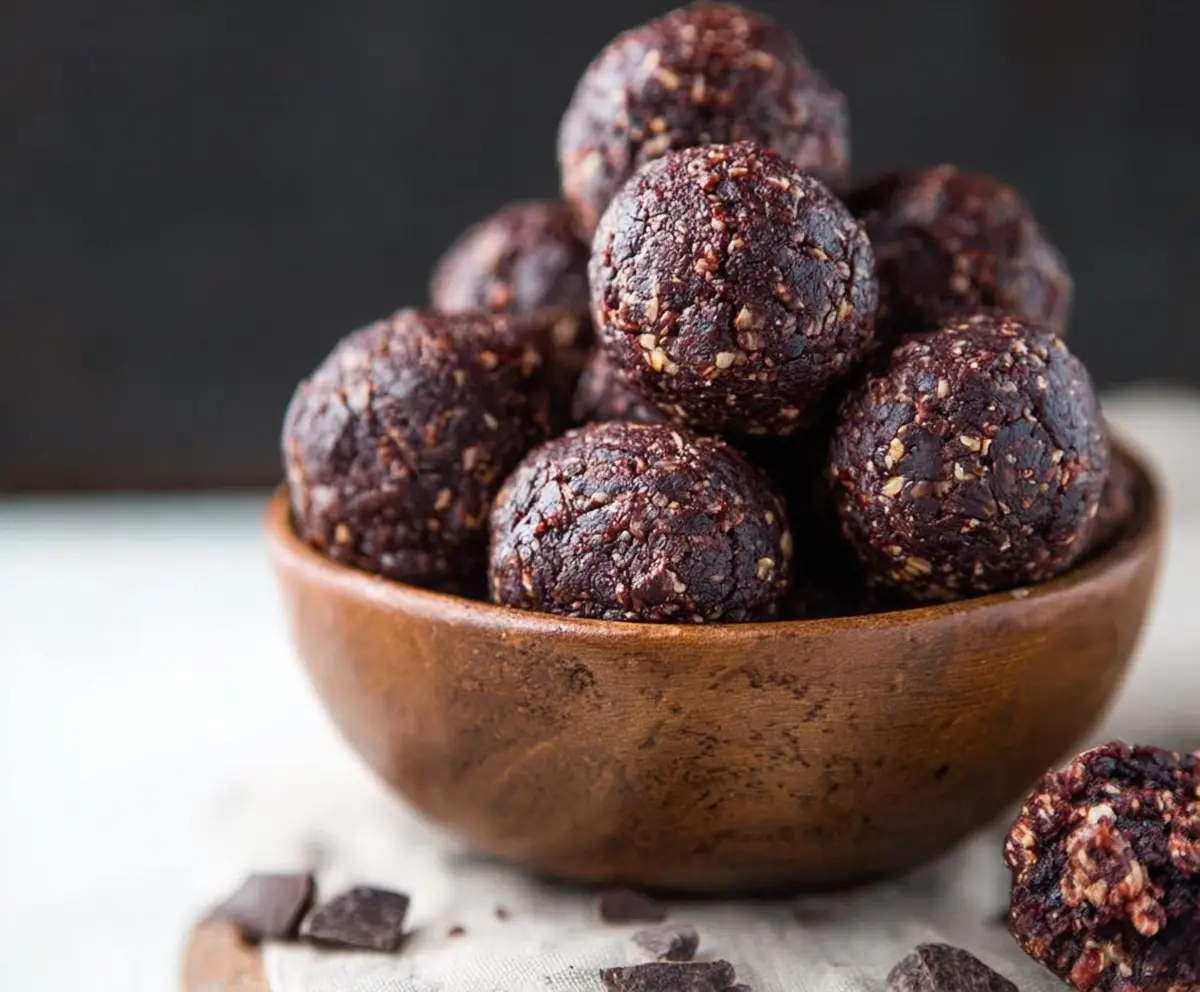 Delicious homemade dark chocolate energy bites with cocoa and healthy ingredients for a nutritious snack.